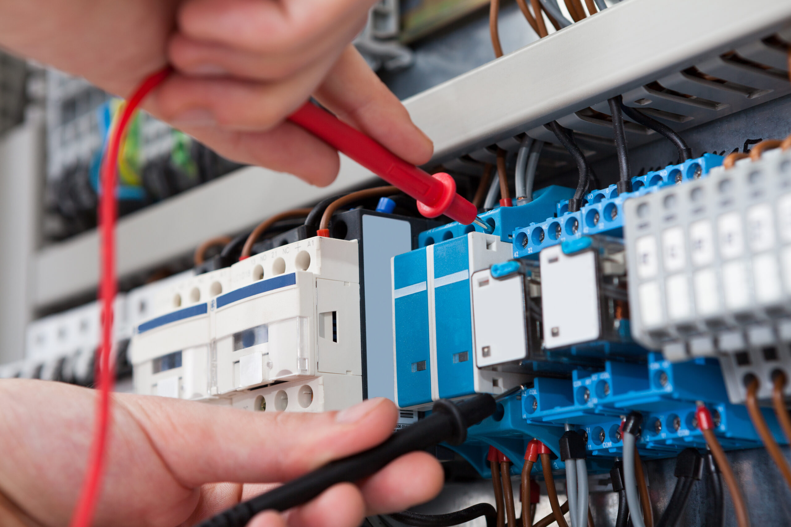 Ross electrician Millington TN working on electrical panel